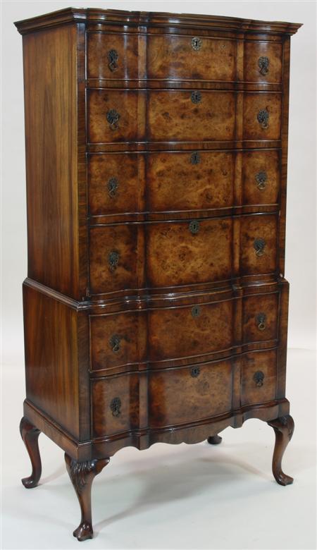 Appraisal: An Edwardian Queen Anne style walnut serpentine tallboy the projected