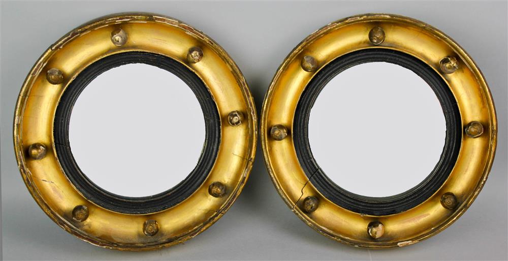 Appraisal: PAIR OF REGENCY STYLE PARCEL EBONIZED GILTWOOD CONVEX MIRRORS each