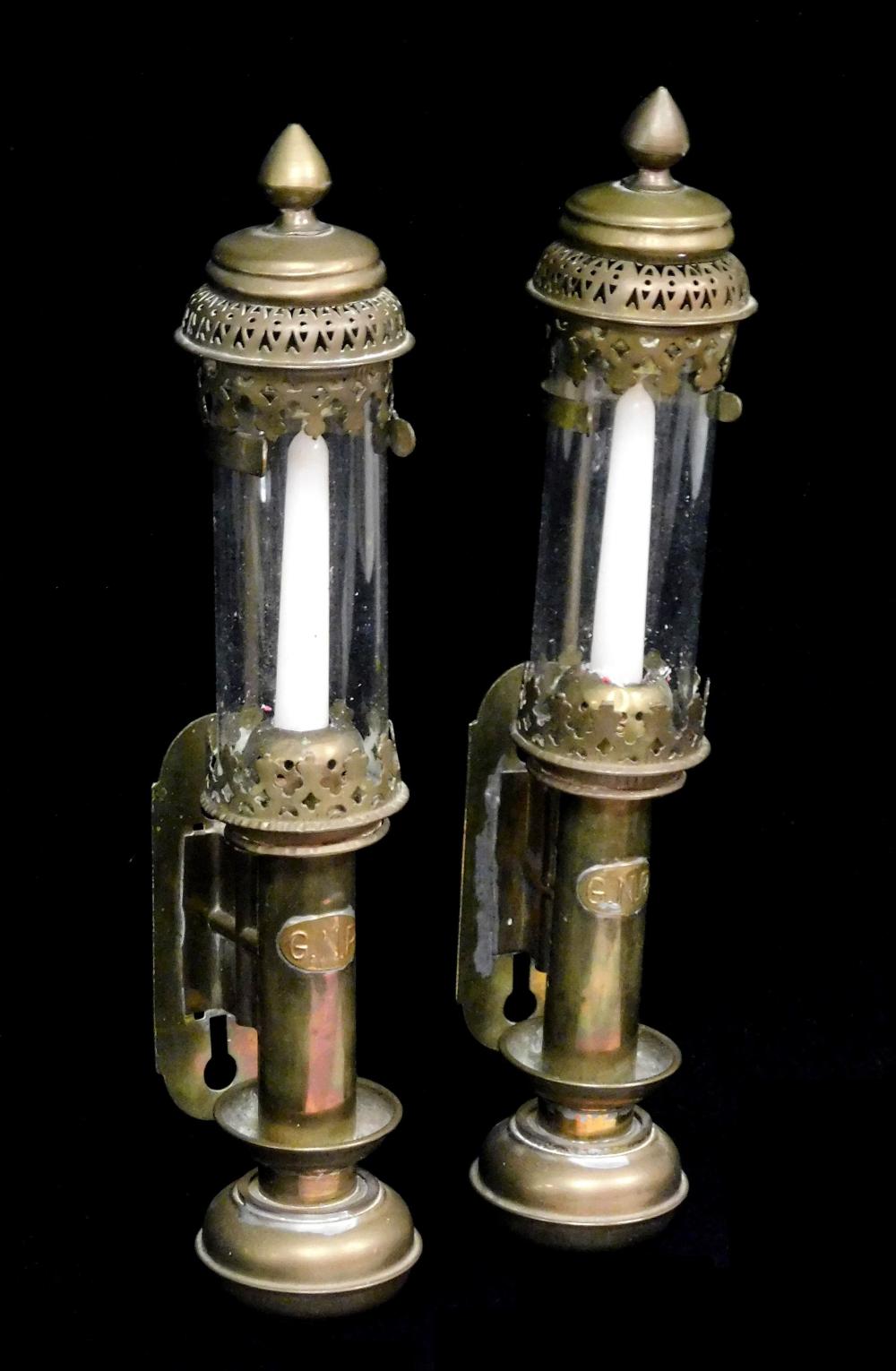 Appraisal: Pair of metal wall mounted candlestick holders with clear cylinder