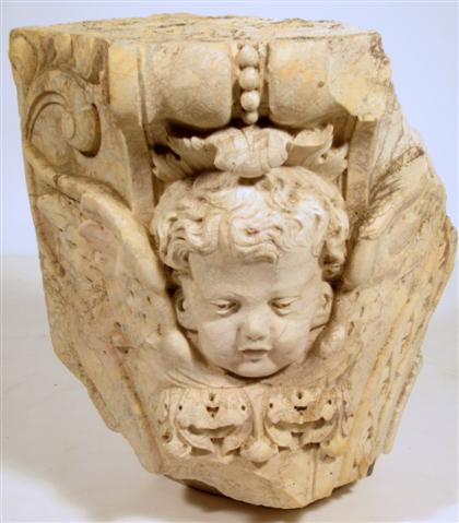 Appraisal: Continental white stone architectural elementCarved to show a child's face