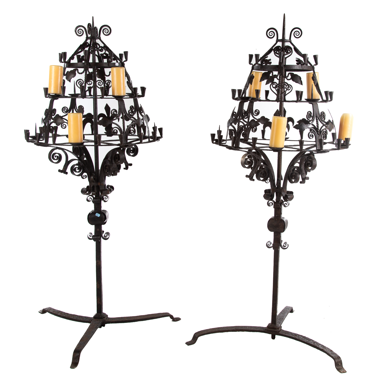 Appraisal: A PAIR OF LARGE GOTHIC STYLE FORGED IRON CANDELABRAS Two-