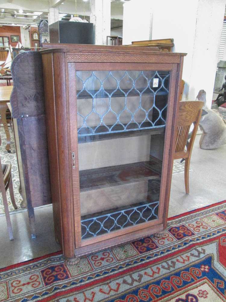 Appraisal: AN OAK AND LEADED GLASS CABINET BOOKCASE American c the