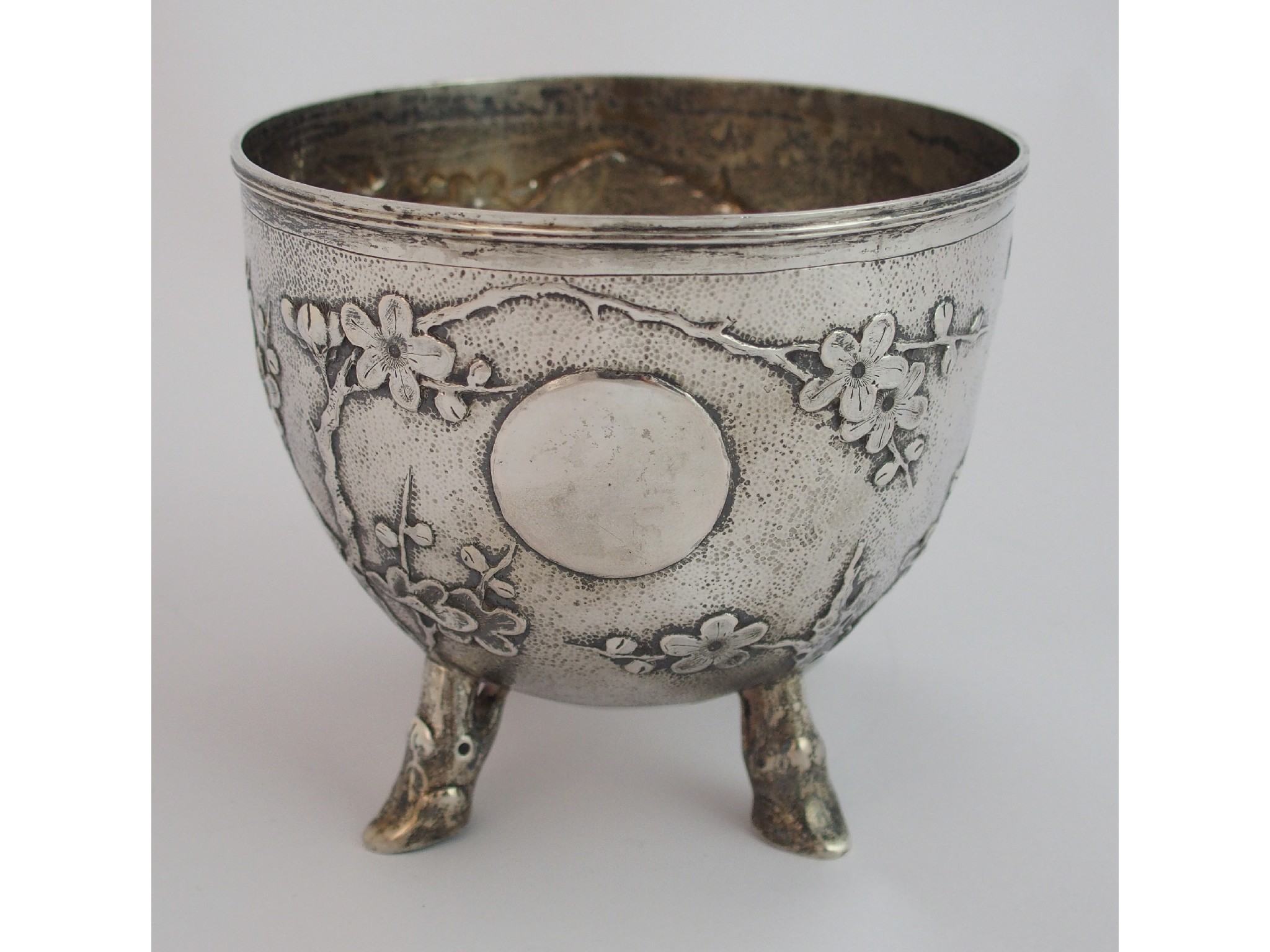 Appraisal: A Chinese silver sugar bowlcast with blossoming branches divided by