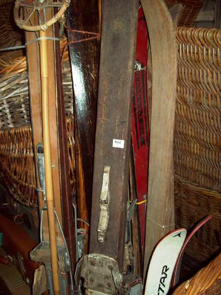 Appraisal: A COLLECTION OF ANTIQUE WOODEN SKIS AND SKI POLLS