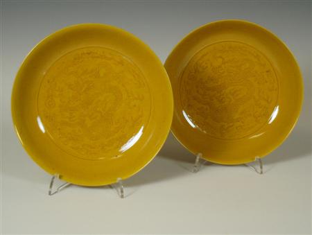 Appraisal: A pair of Chinese yellow glazed bowls Daoguang Period each