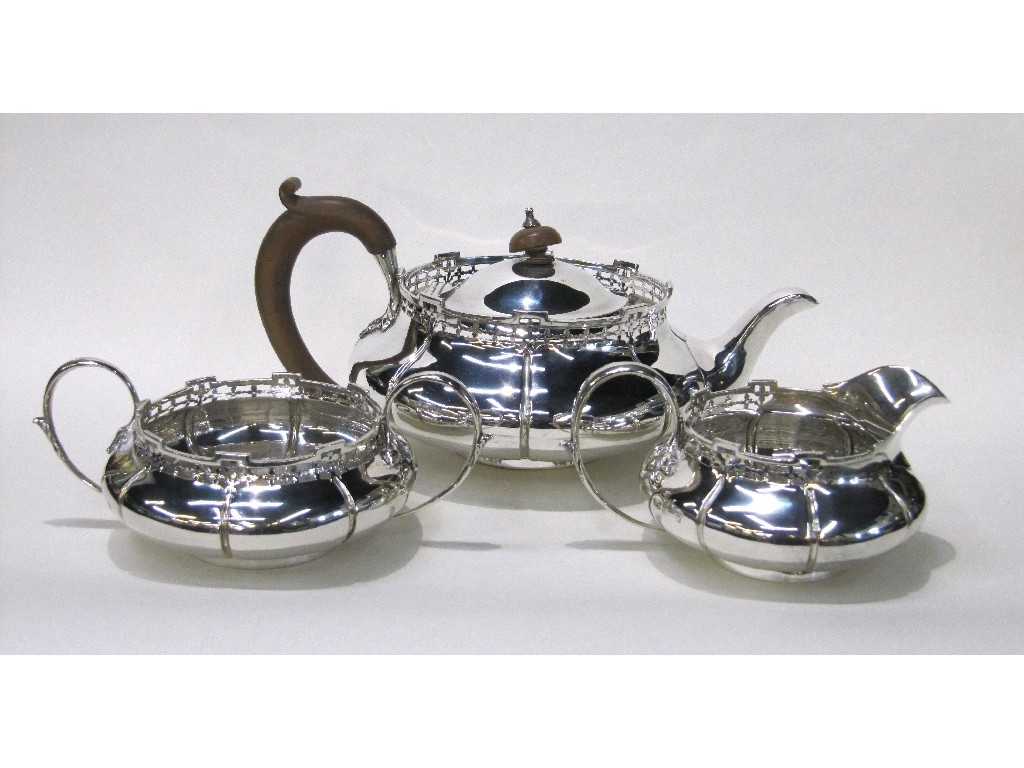 Appraisal: Three piece silver tea service with pierced gallery Birmingham