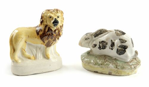 Appraisal: A th century Staffordshire yellow glazed lion cm wide and