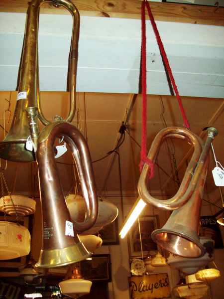 Appraisal: THREE COLLECTABLE BRASS TRUMPETS ONE IS FRENCH 'COUESNON'