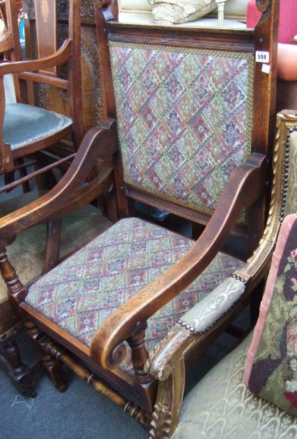 Appraisal: A th century walnut framed high back armchair on block