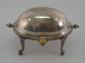 Appraisal: A Victorian silver butter dish with swing over cover on