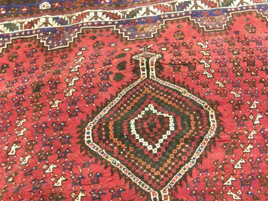 Appraisal: Shiraz rug with multiple borders and repeating stepped medallion motif