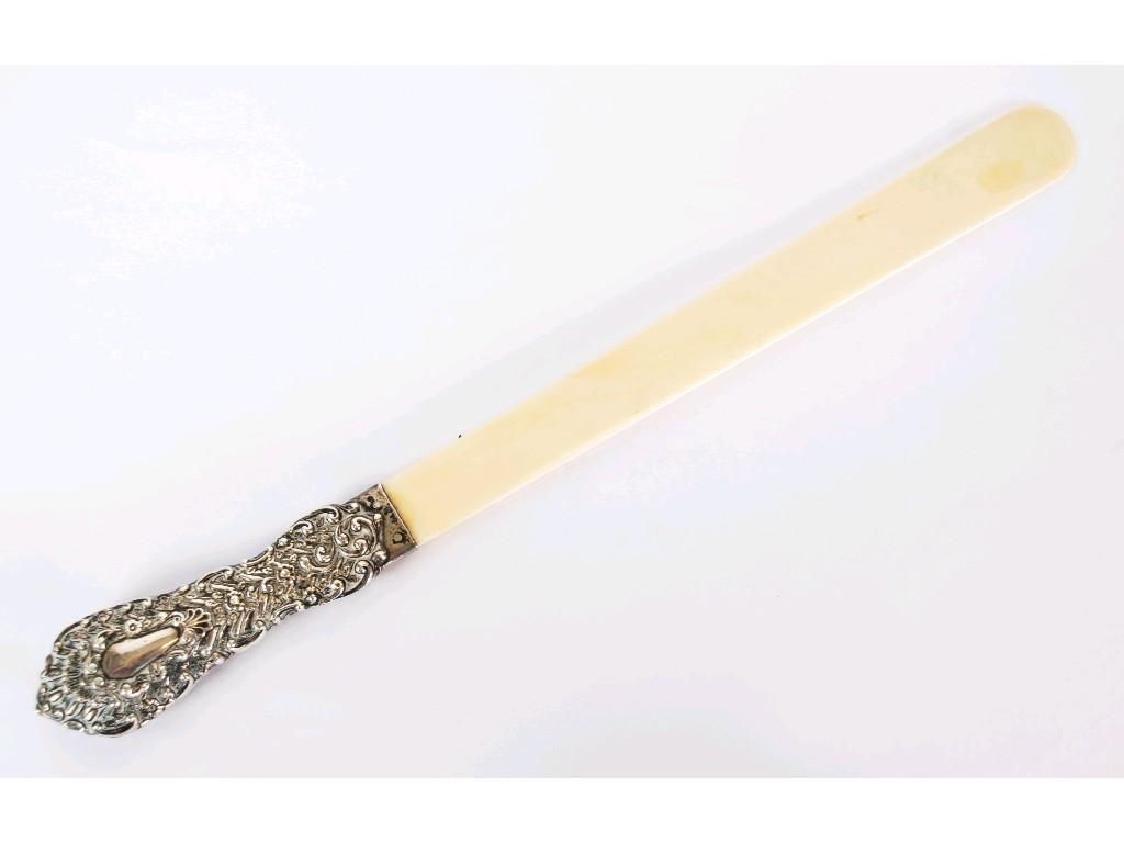 Appraisal: VICTORIAN CARVED IVORY LETTER OPENER with silver handled repousse with