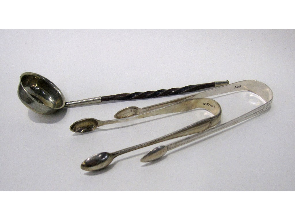 Appraisal: Lot comprising two pairs of silver sugar tongs and a