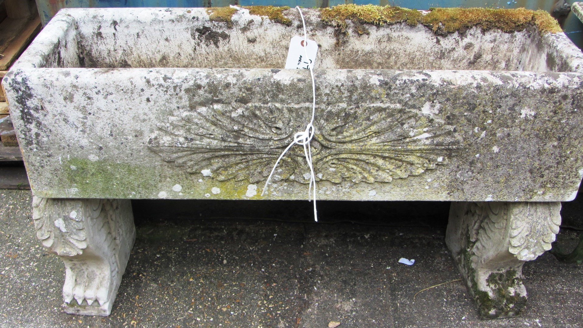 Appraisal: A reconstituted stone rectangular planter on a pair of scroll