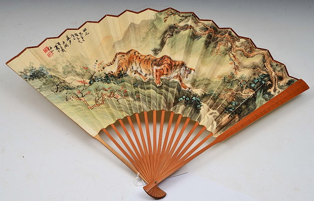 Appraisal: A CHINESE FOLDING PAPER FAN painted with a tiger with