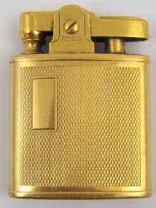 Appraisal: A ct gold cased Ronson petrol lighter C