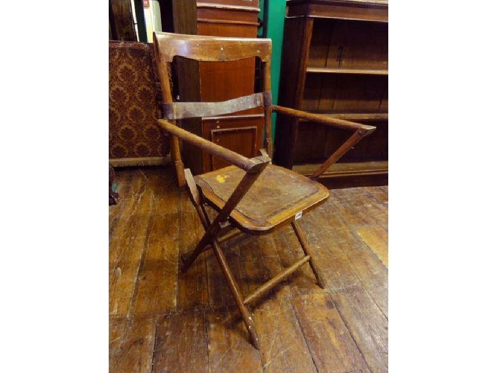 Appraisal: A Campaign chair with folding frame and bar back over