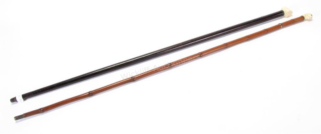 Appraisal: Sword and Carved Handled Dress Canes sword cane with bamboo