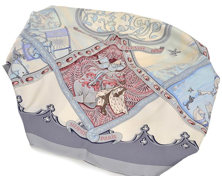 Appraisal: A SILK SCARF BY HERMES 'La vie a cheval' design