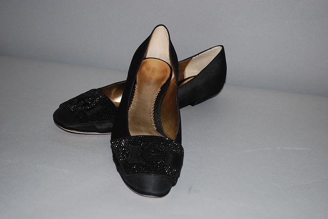 Appraisal: Giorgio Armani black fabric shoe with signature crest on toe