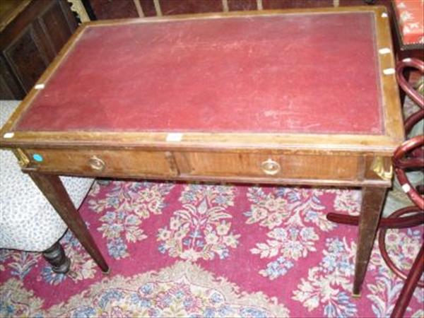 Appraisal: A gilt metal mounted mahogany library table on square tapering