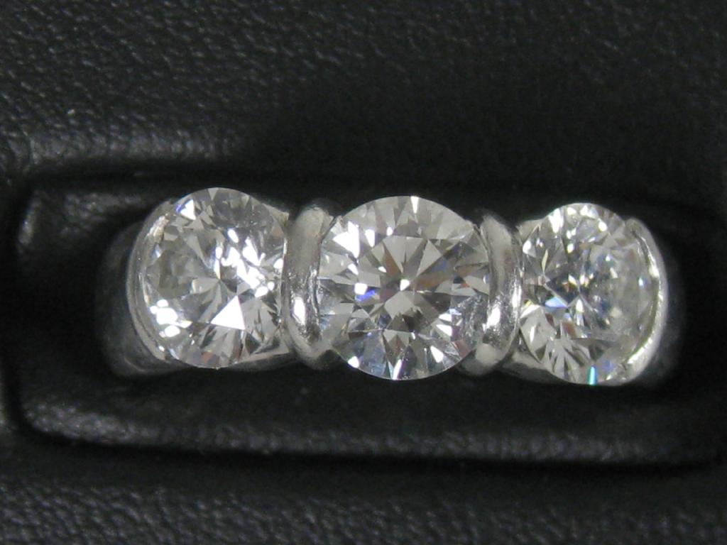 Appraisal: A Tiffany Co 'Etoile' three stone Diamond Ring the brilliant-cut