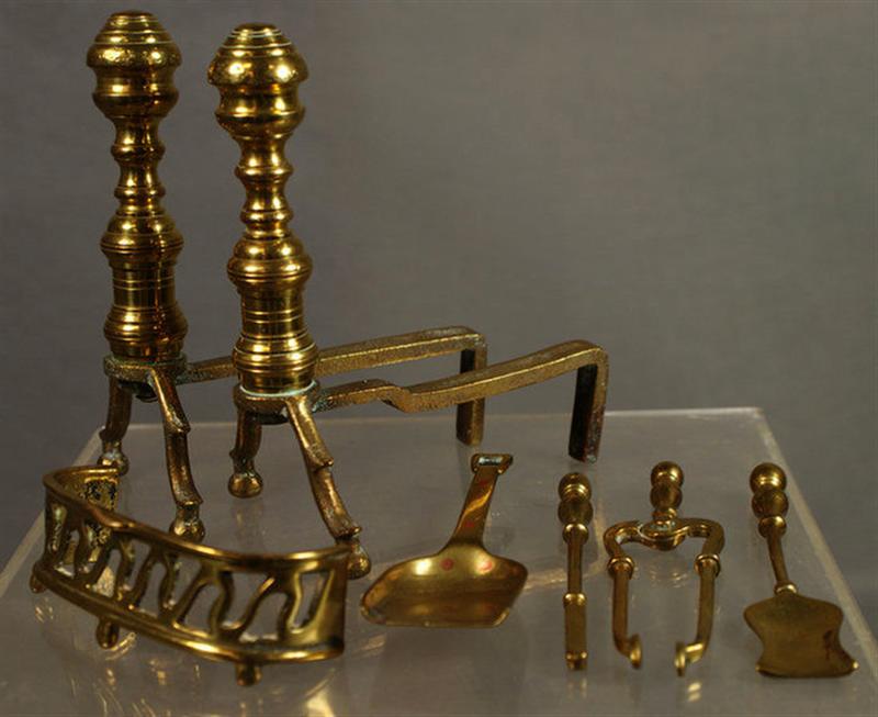 Appraisal: Pr miniature brass andirons fender tools tilt top candle stand