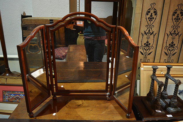 Appraisal: A walnut three fold dressing mirror