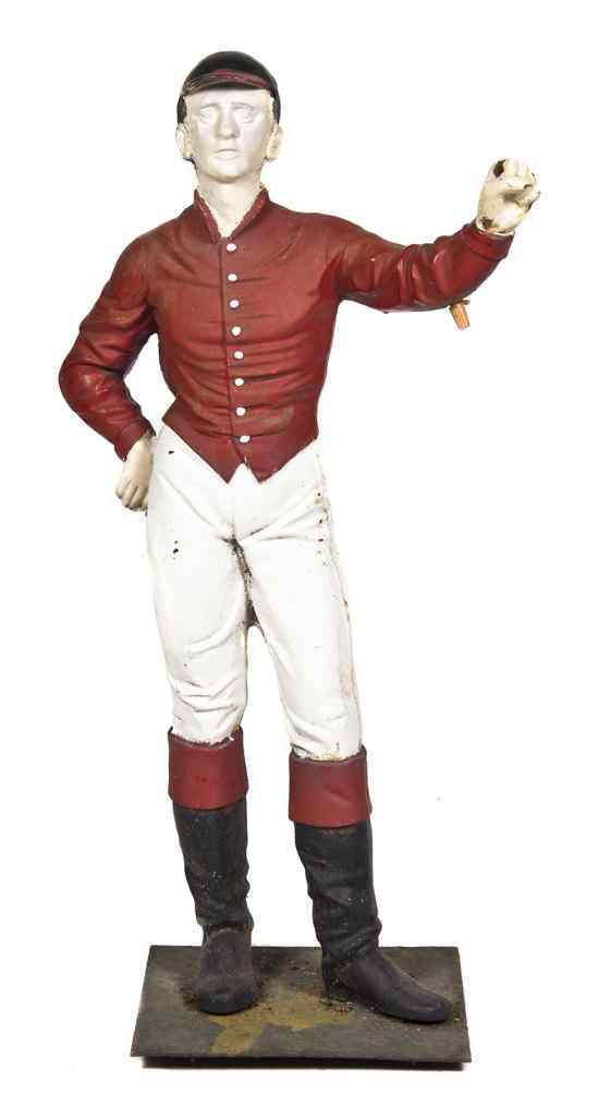 Appraisal: A Painted Iron Lawn Jockey in typical standing pose lacking