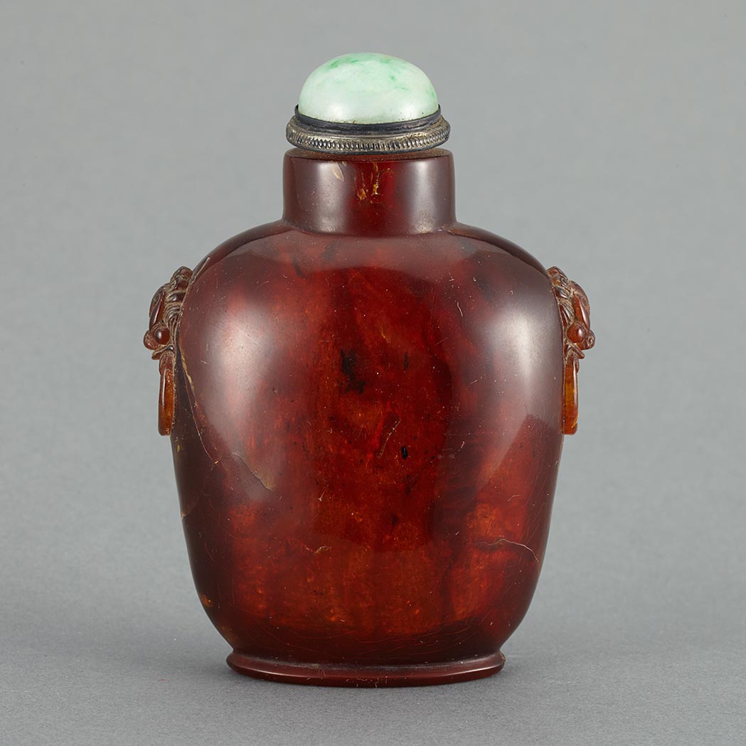 Appraisal: Chinese Amber Snuff Bottle th Century The well hollowed rectangular