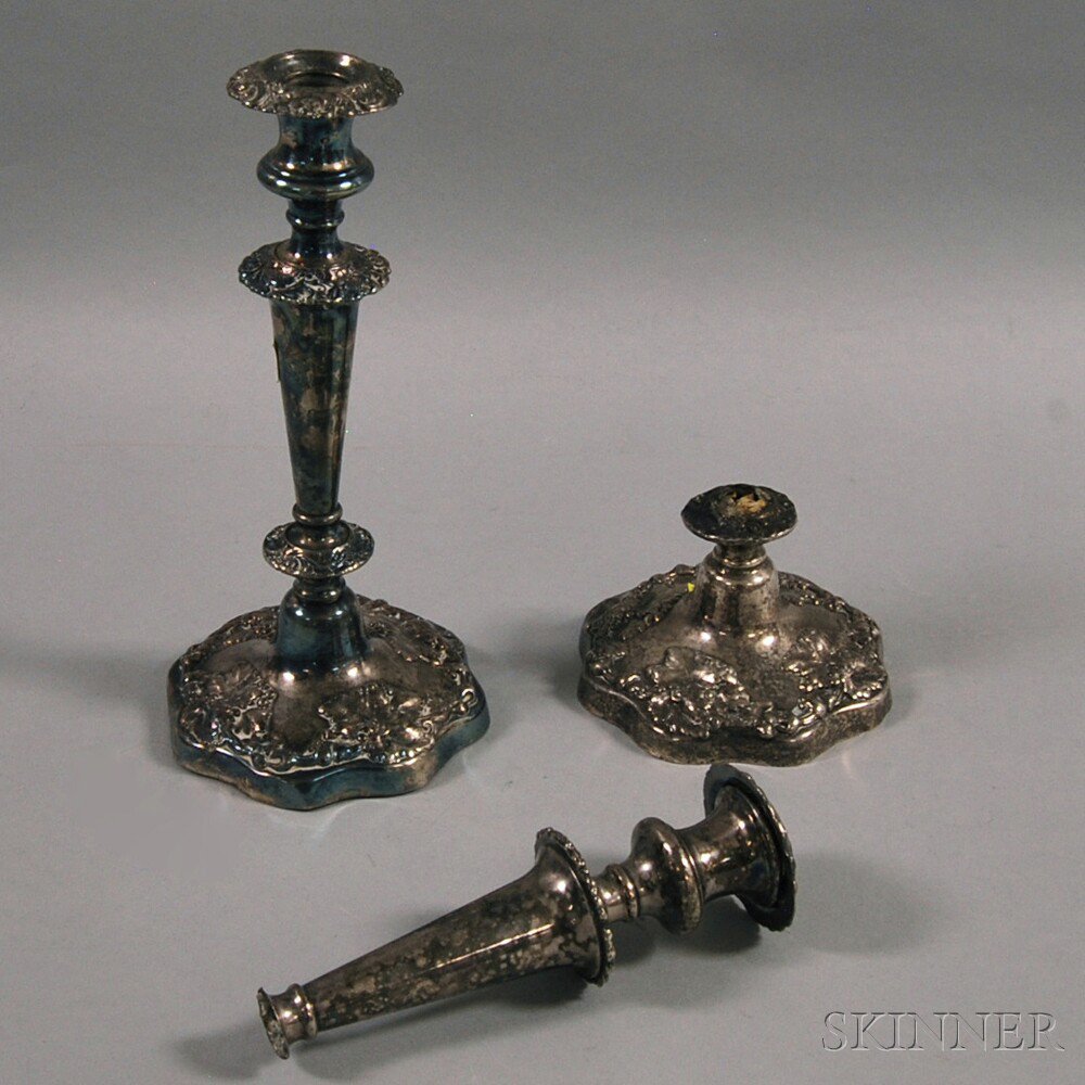 Appraisal: Pair of Unmarked Weighted Repousse Candlesticks one broken ht in