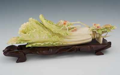 Appraisal: A Chinese Carved Ivory Cabbage Leaf with Cricket Intricately carved