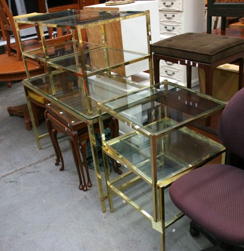 Appraisal: A brass framed glass topped desk together with four square