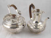 Appraisal: A very large silver tea kettle circular with ribbed sides