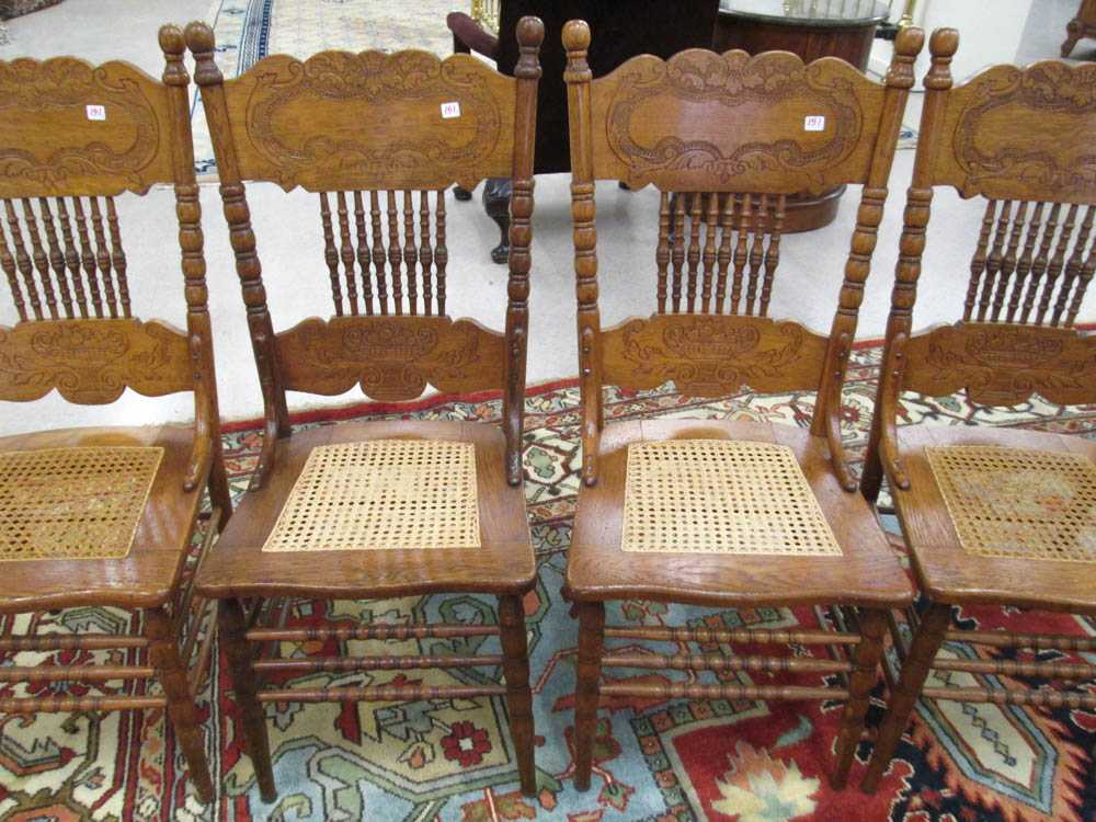 Appraisal: A SET OF FOUR OAK PRESS-BACK DINING CHAIRS American c