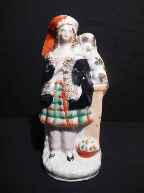 Appraisal: th century English Staffordshire figurine depicting a man with a