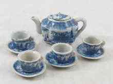 Appraisal: A Victorian child's tea set comprising teapot four cups and