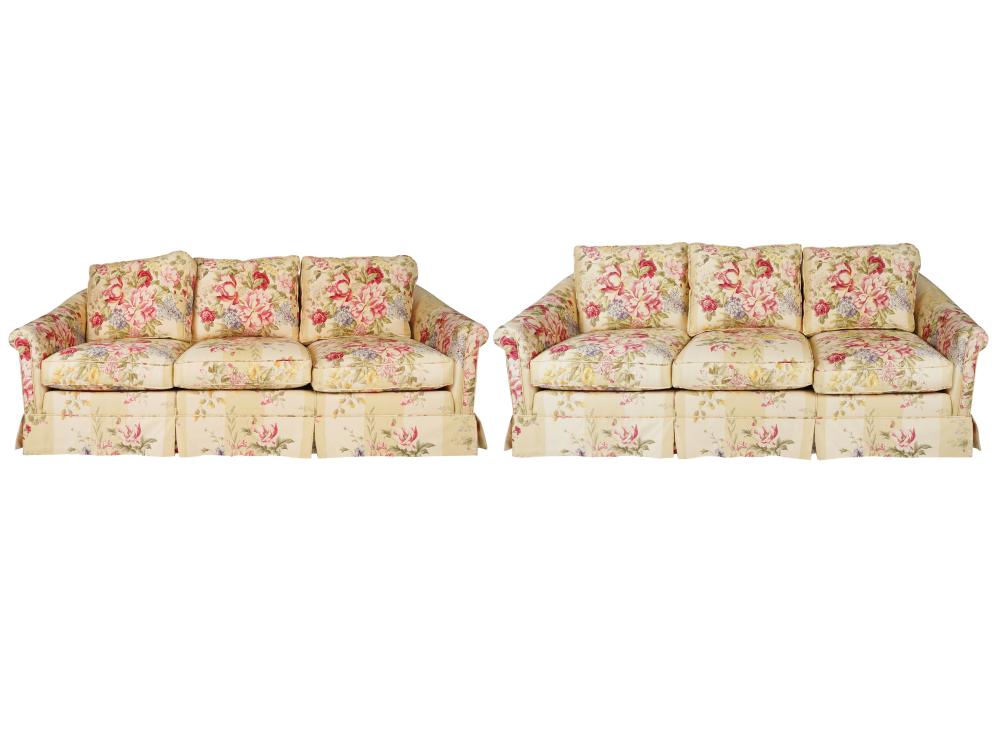 Appraisal: PAIR OF FLORAL PRINT UPHOLSTERED SOFASeach with loose seat and