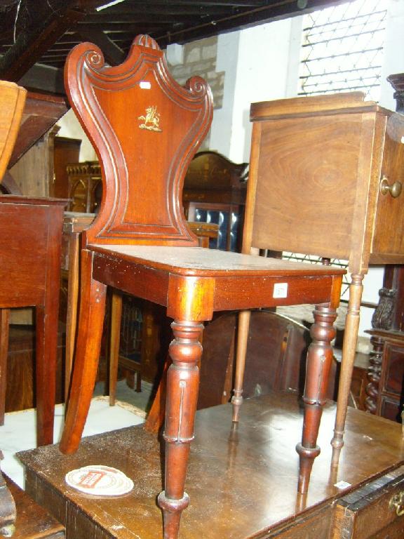 Appraisal: A th century mahogany hall chair with shield shaped back