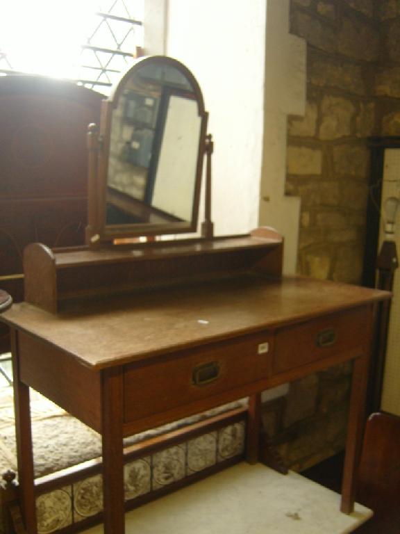 Appraisal: A Heal Son oak dressing table fitted with two frieze