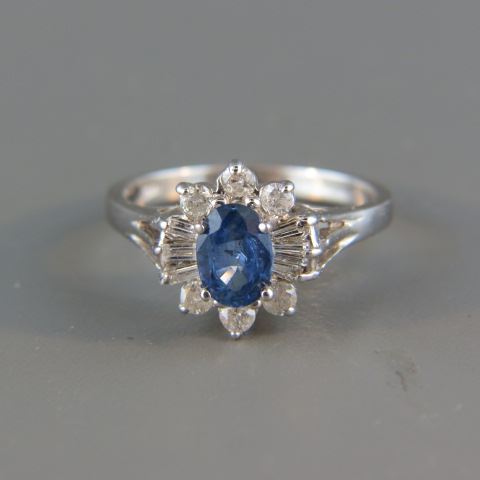 Appraisal: Sapphire Diamond Ring rich blue oval gem weighing carat surrounded