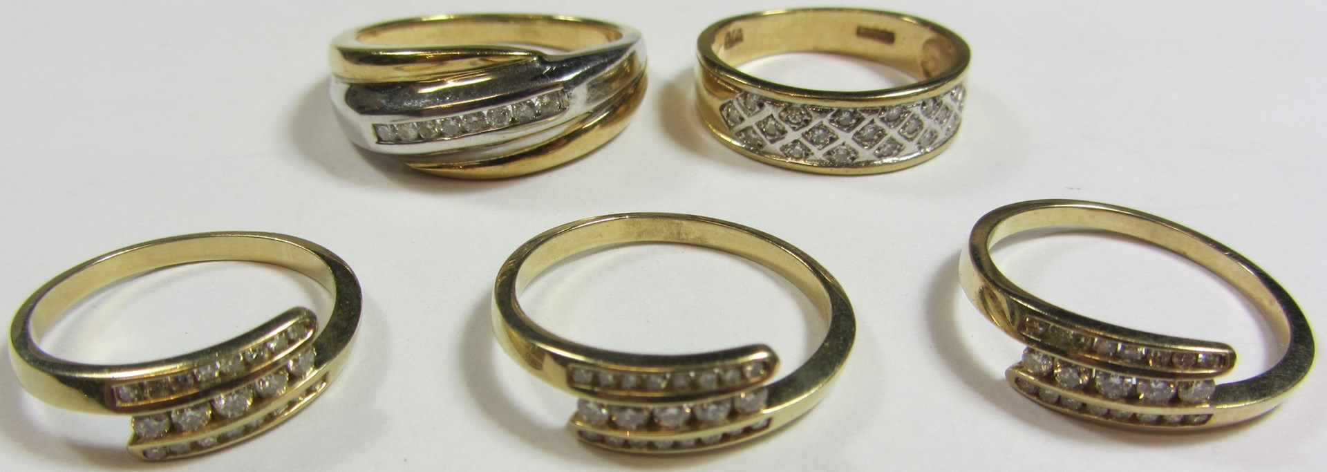 Appraisal: Five modern ct gold and diamond half eternity rings in