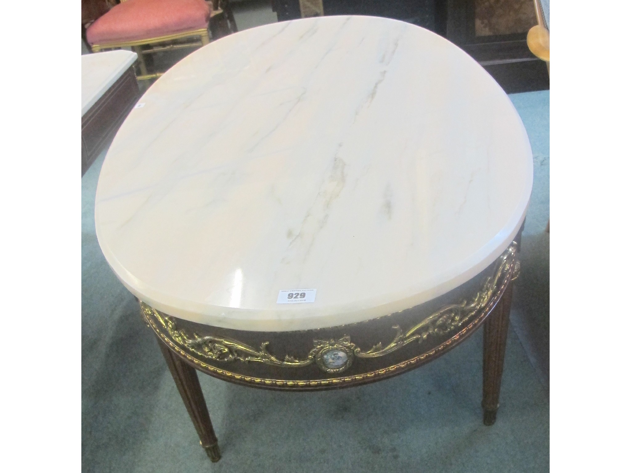 Appraisal: A modern oval marble topped coffee table