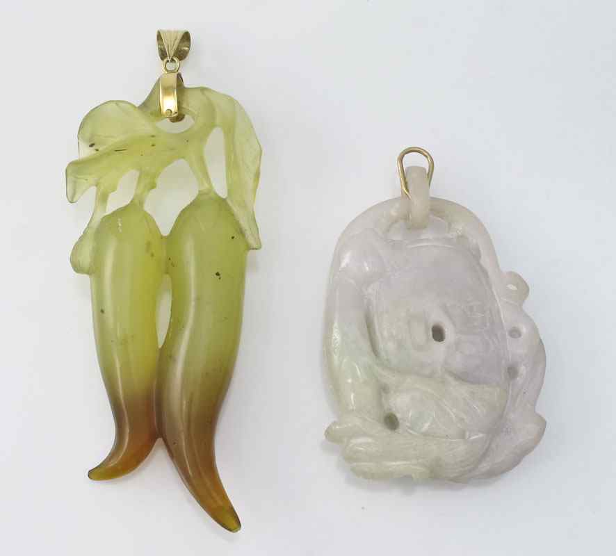 Appraisal: CARVED STONE PENDANTS Possibly jade disc with dragon coiled around