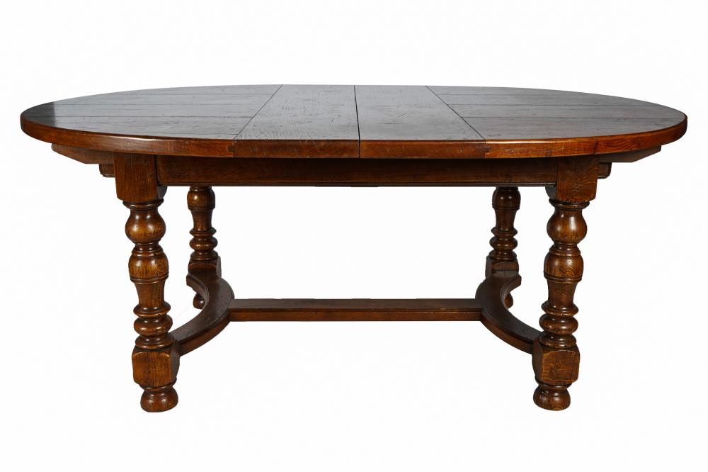 Appraisal: OVAL CARVED OAK DINING TABLEwith two leaves Condition refinished inches