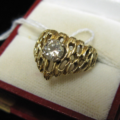 Appraisal: DIAMOND AND FOURTEEN KARAT GOLD SOLITAIRE RING the pierced chevron