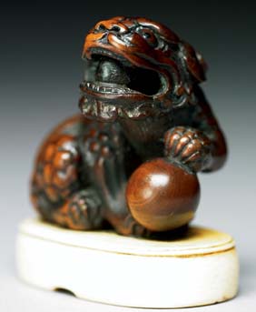 Appraisal: ANTIQUE BOXWOOD NETSUKE Well carved and antique boxwood netsuke of