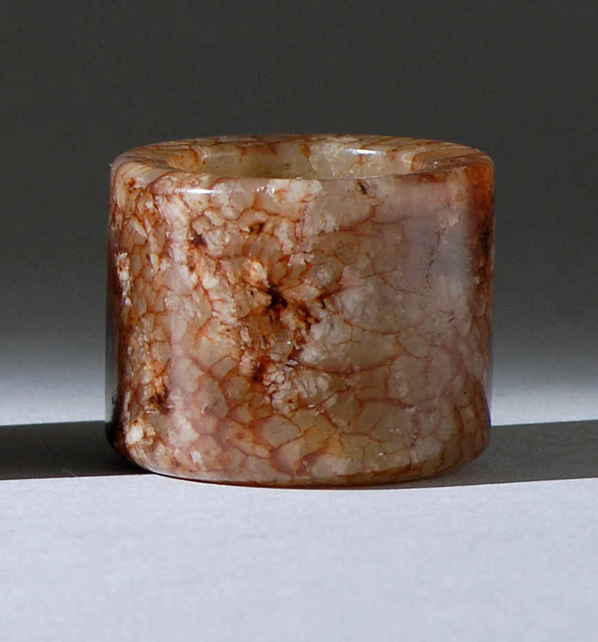 Appraisal: FINE MUTTON-FAT JADE ARCHER'S RING th CenturyIn simple cylinder form