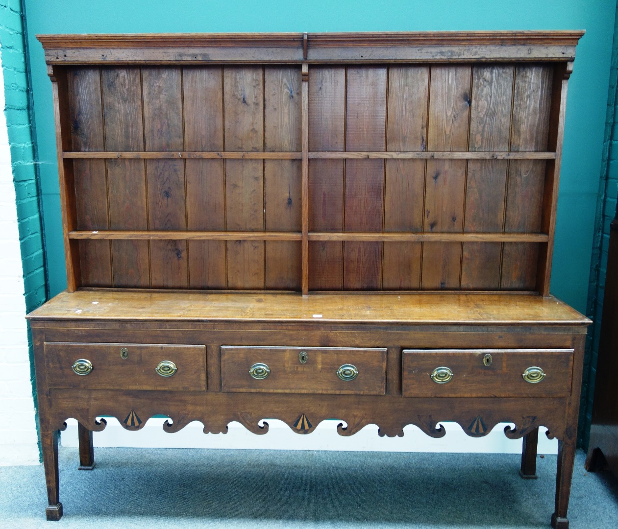 Appraisal: A George III mahogany banded oak dresser the later enclosed