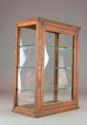 Appraisal: A Wood And Glass Table Display CaseDisplay case accented in